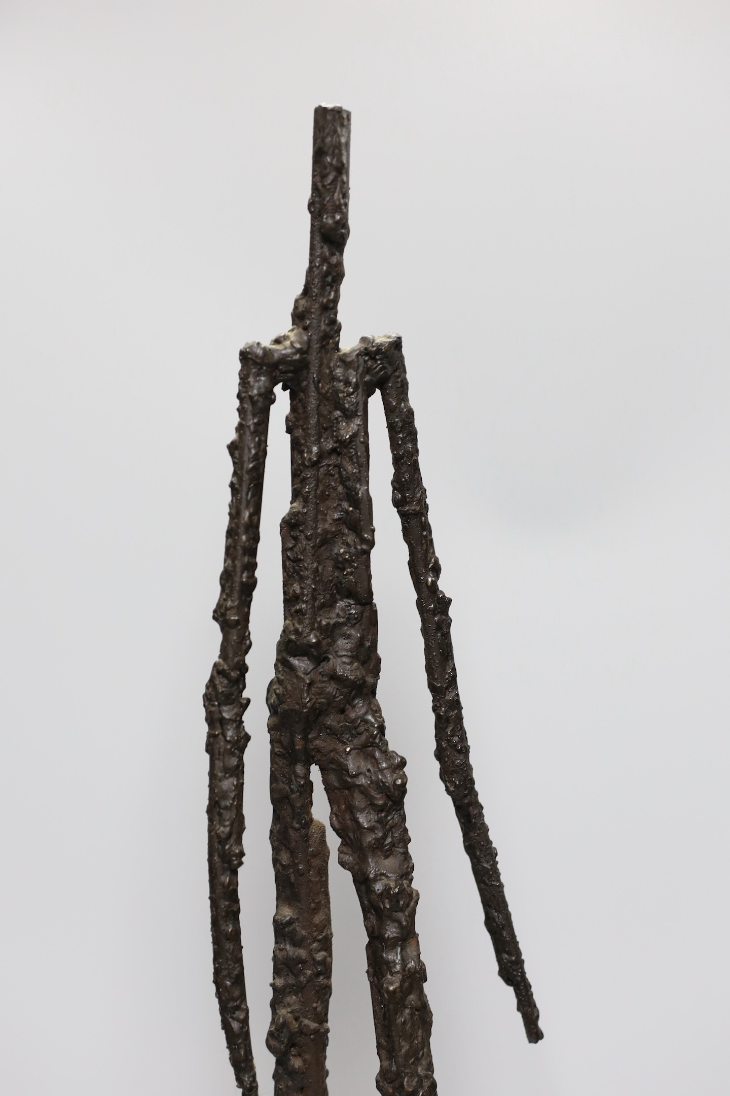 A 20th century abstract figural bronze, 63cms high